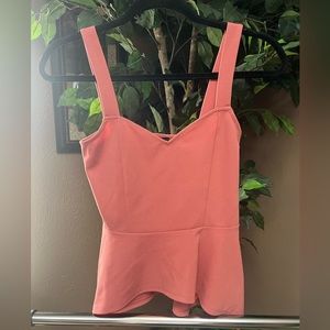 Express Sweetheart Neckline with Peplum. Peach in a size XS
